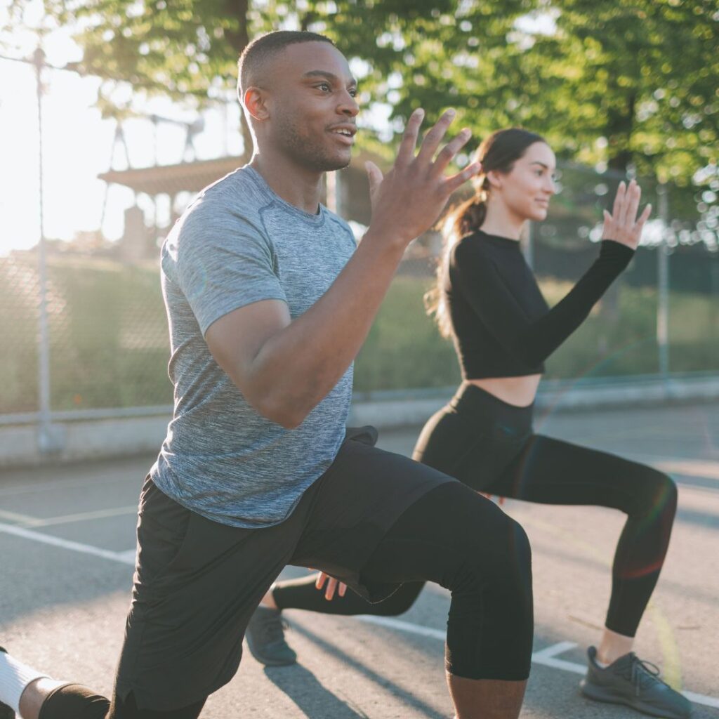 Diverse Athletic Couple Exercising Outdoors