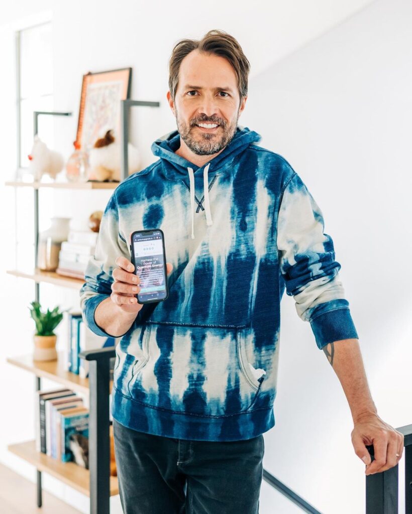 Man standing with the phone in the living room