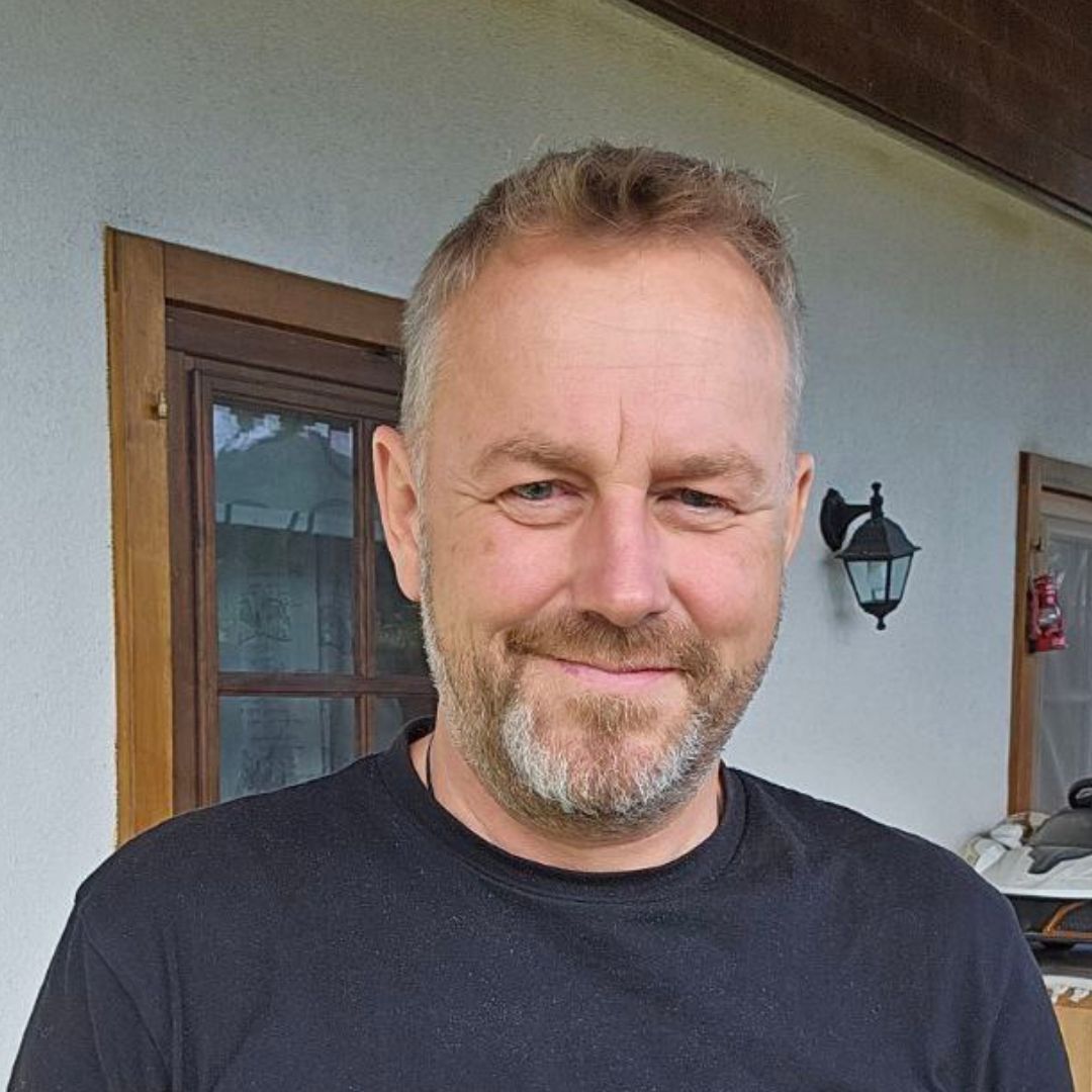 Man looking at a camera. Johannes Koller