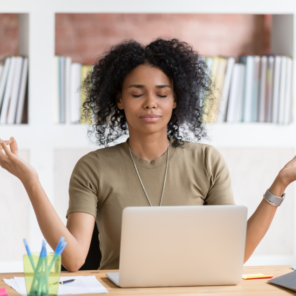 Woman Meditating at Her Work Desk
