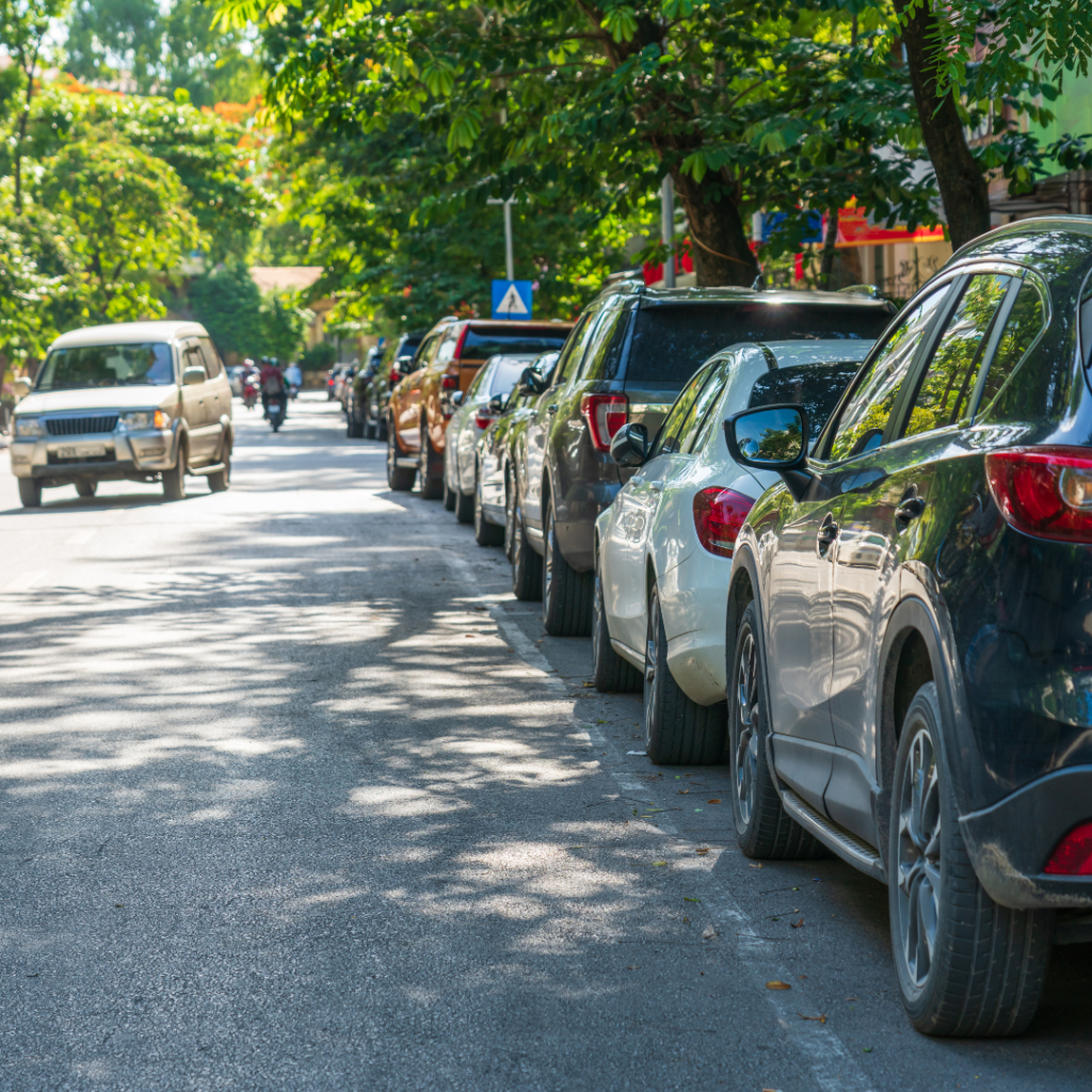 Hanoi Street with Cars Parked on the Street Side