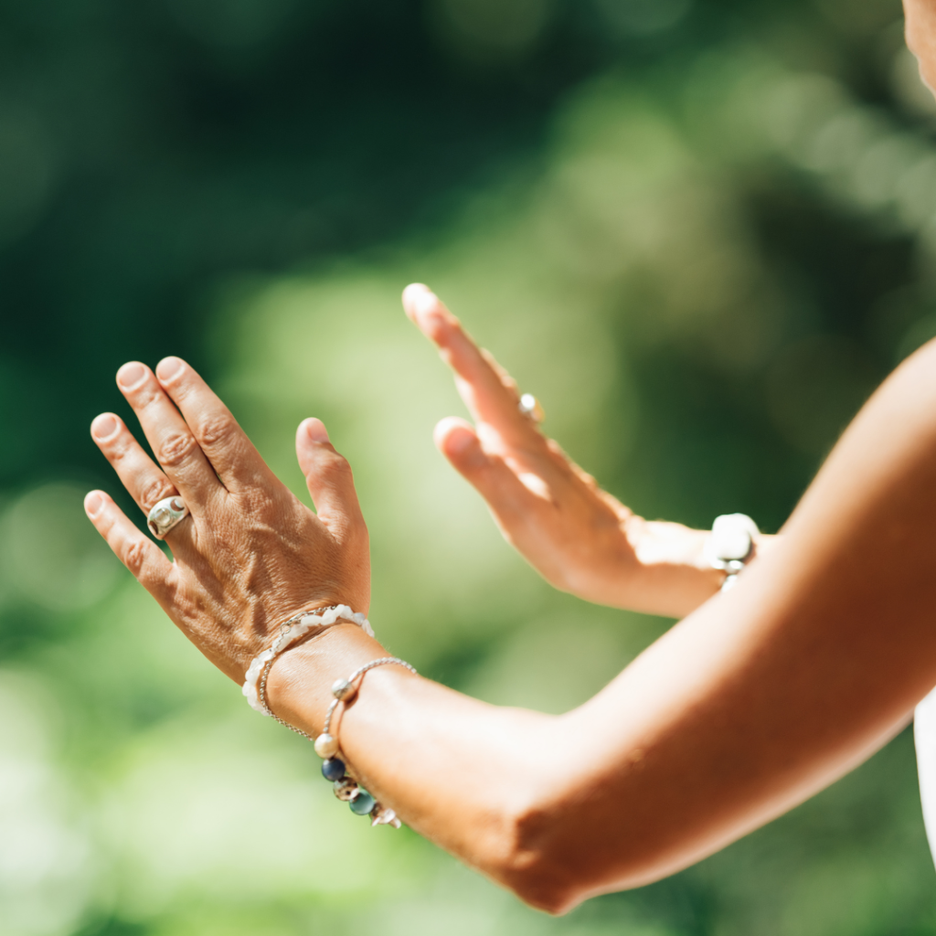 Middle Aged Woman Practicing Tai Chi Chuan in the Park. Close Up On Hands Position