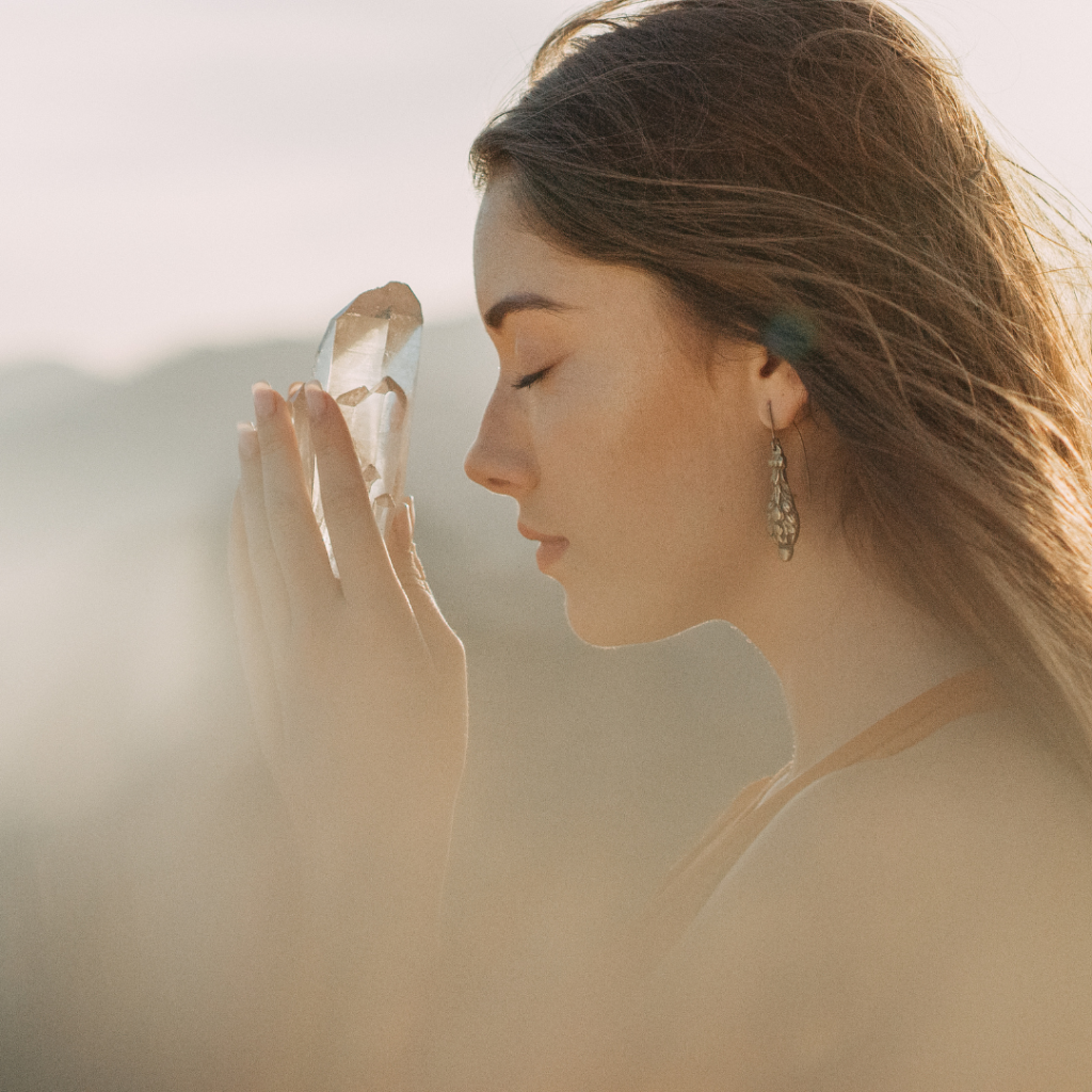 Woman's head with a healing crystal