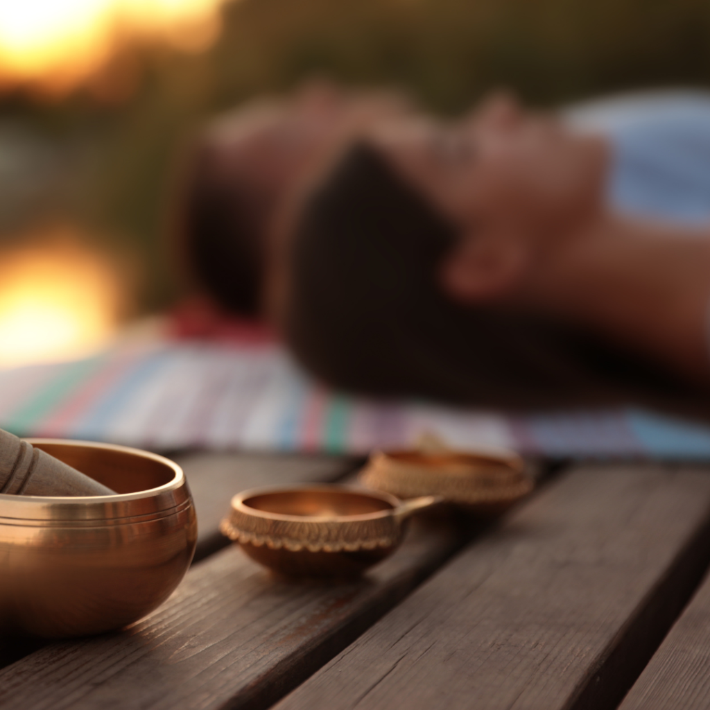 Couple at Healing Session Outdoors, Focus on Singing Bowl