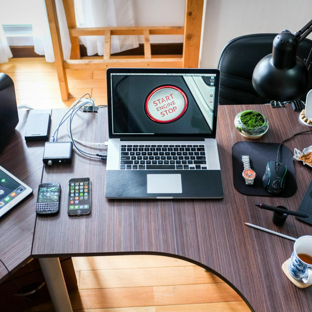 Black and White Laptop Computer on Brown Wooden Desk