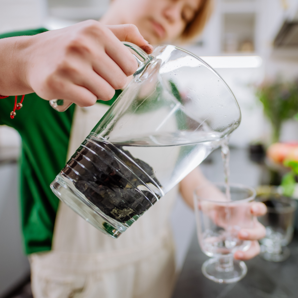 Girl Pouring Water from Jar with Shungite Stones⁠(opens in a new tab or window)