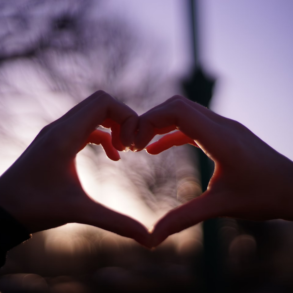 persons hand forming heart