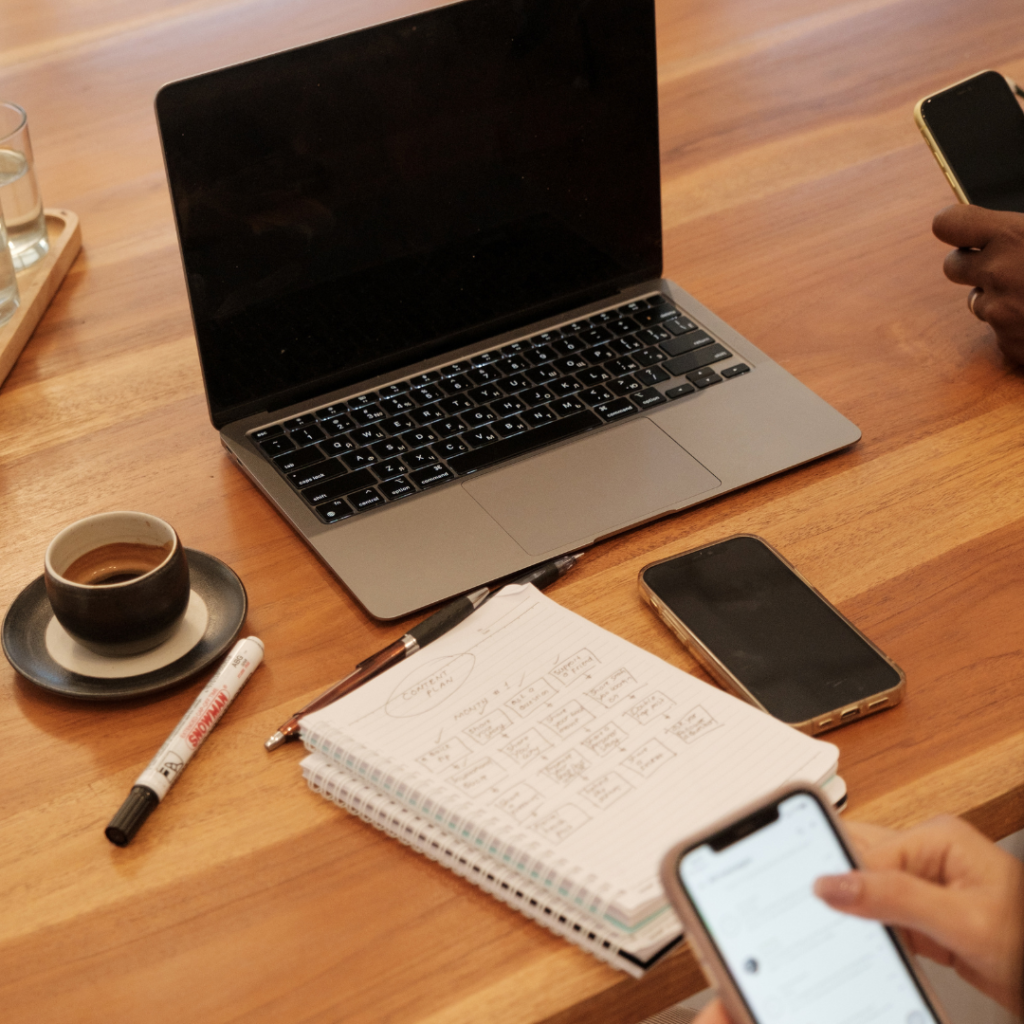 Man Working with a Laptop and Smartphone