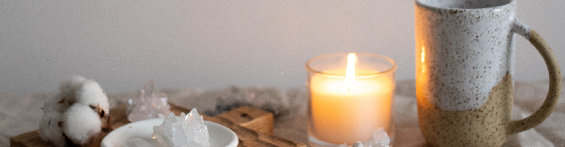 Mug Near Candle and Healing Crystals