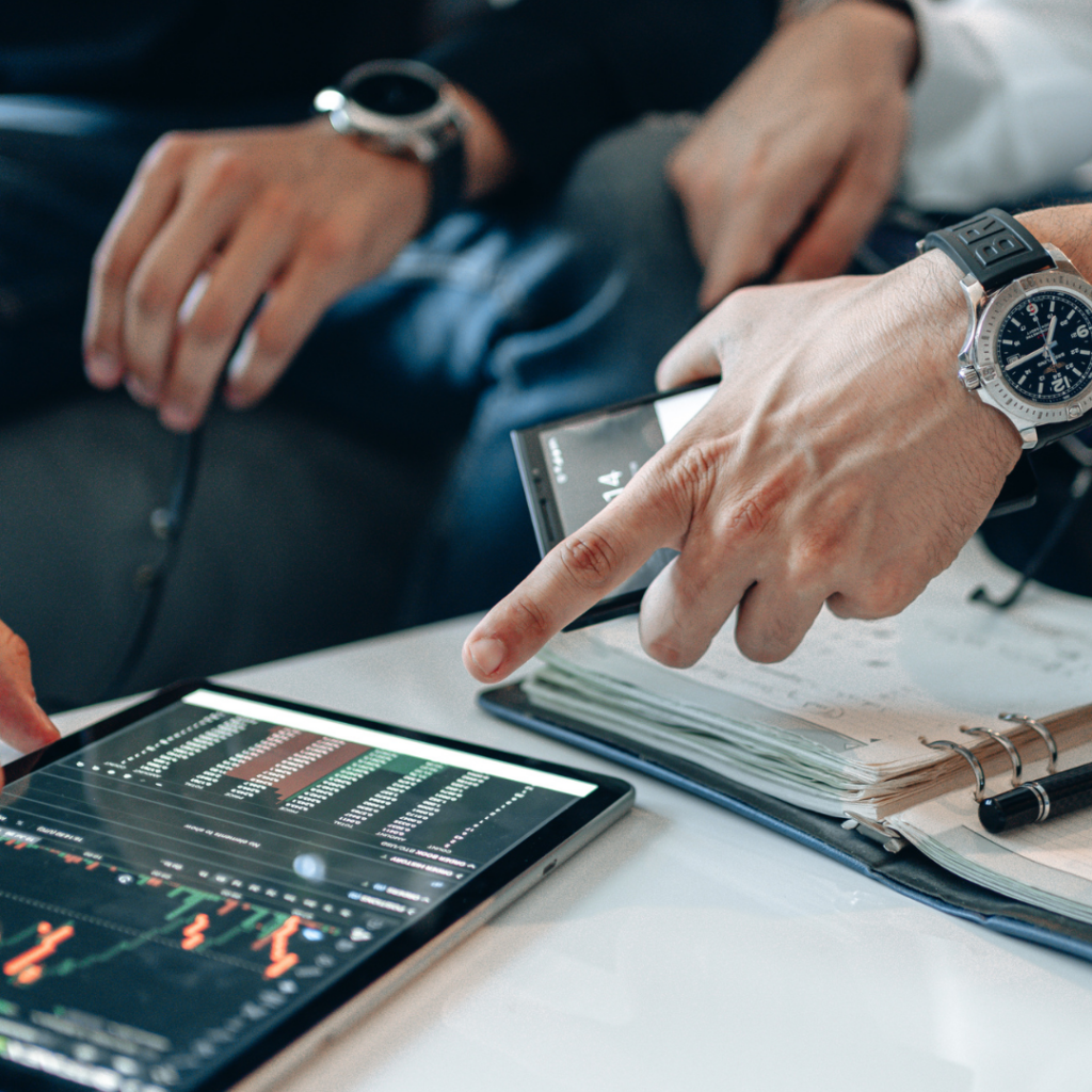 Traders Wearing Wristwatch Pointing the Screen of the Tablet with Crypto Graph